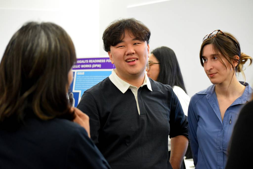 a student laughing with other students